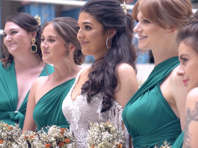 Bride and bridesmaids standing in line